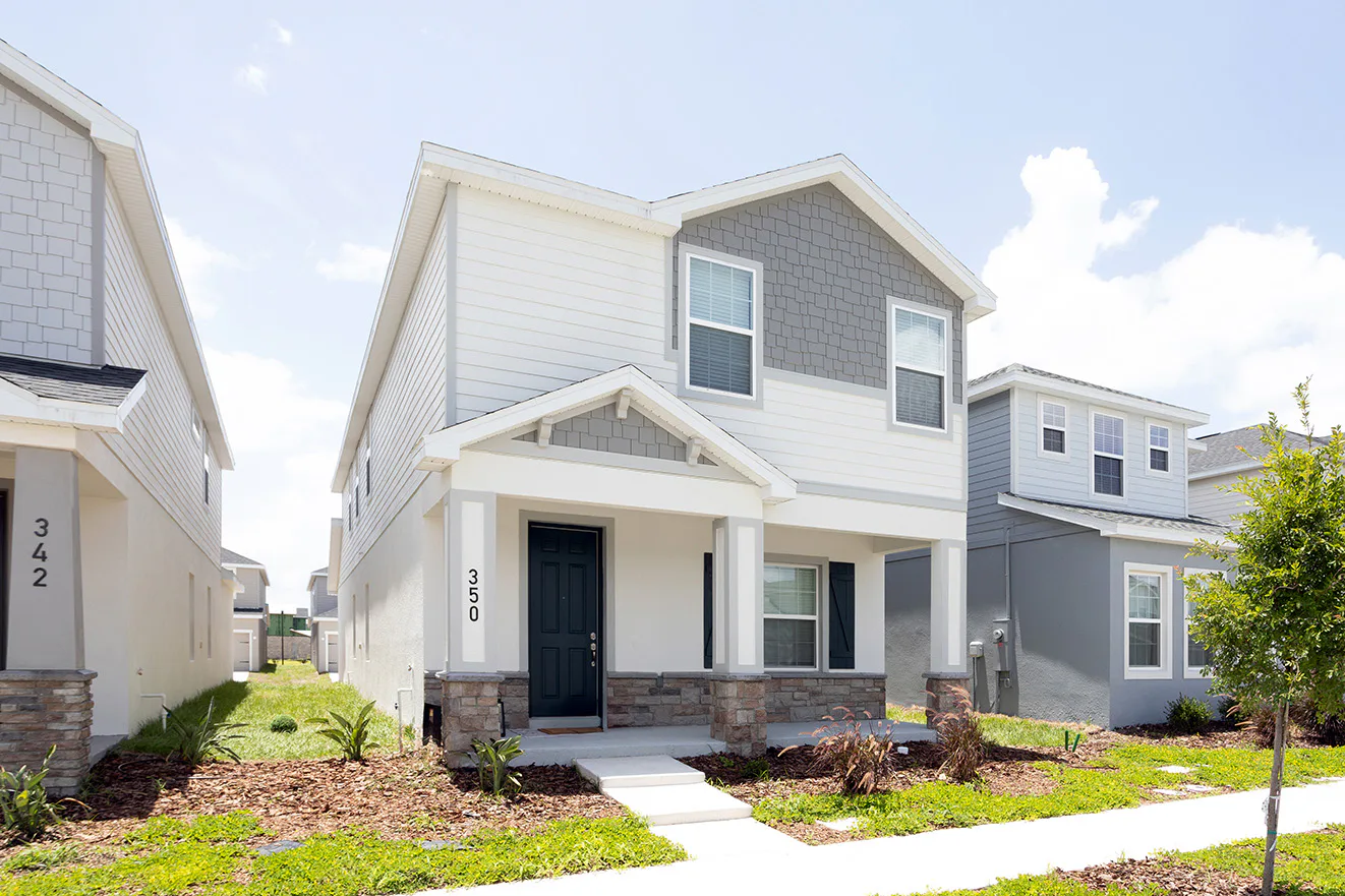 Alley access home designs provide curb appeal, with the garage hidden out of site.